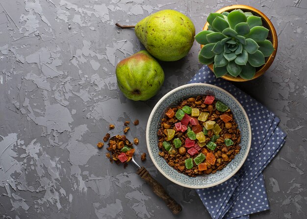 A top-down shot of a colorful bowl filled with quinoa, roasted vegetables (such as sweet potatoes, broccoli, and bell peppers), chickpeas, and a tahini dressing, showcasing a well-balanced and appealing plant-based bowl.