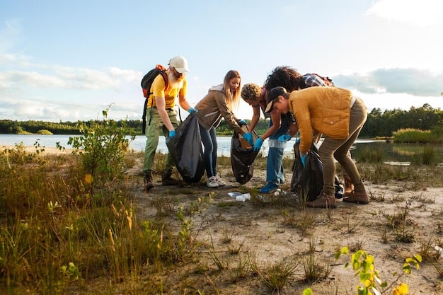 Travelers participating in a volunteer activity, such as planting trees or cleaning up a beach, highlighting the positive impact of sustainable travel on local communities and ecosystems.
