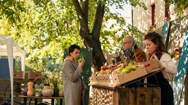 A bustling farmers market with stalls selling fresh, locally sourced produce, emphasizing sustainable sourcing and ethical supply chains.