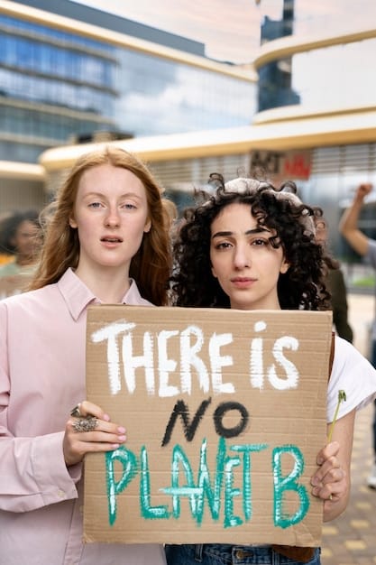 Environmental activists holding signs and protesting for stronger climate policies in front of a government building.
