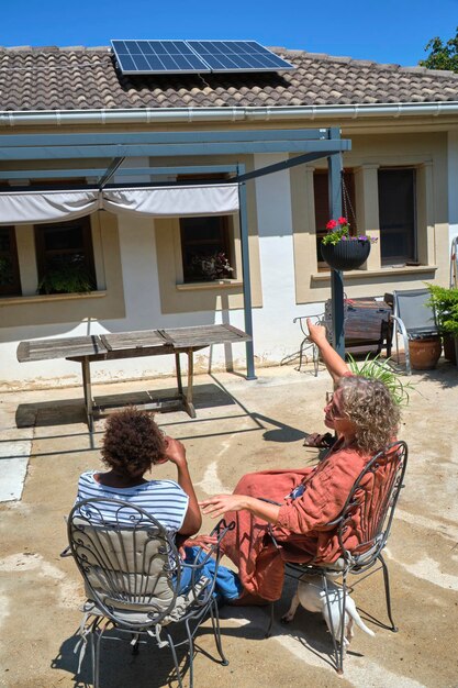 A photo showing a rooftop solar panel installation on a suburban house, illustrating a tangible, local solution to climate change and promoting renewable energy.