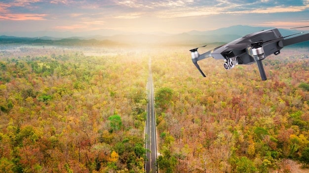 A drone flying over a forest, equipped with sensors for environmental monitoring and data collection for conservation.